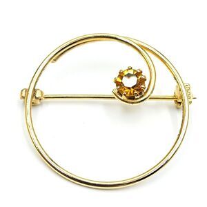 Vintage Goldtone Curlicue Circle with   Gold Rhinestone Accent Brooch